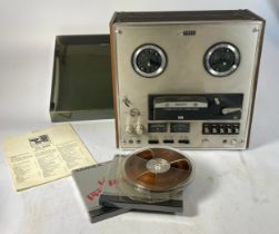 A Sony TC-645 reel to reel player with original operators manual.