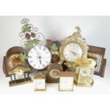 A collection of mid 20th century and later mantel clocks, alarm clocks and barometers in three