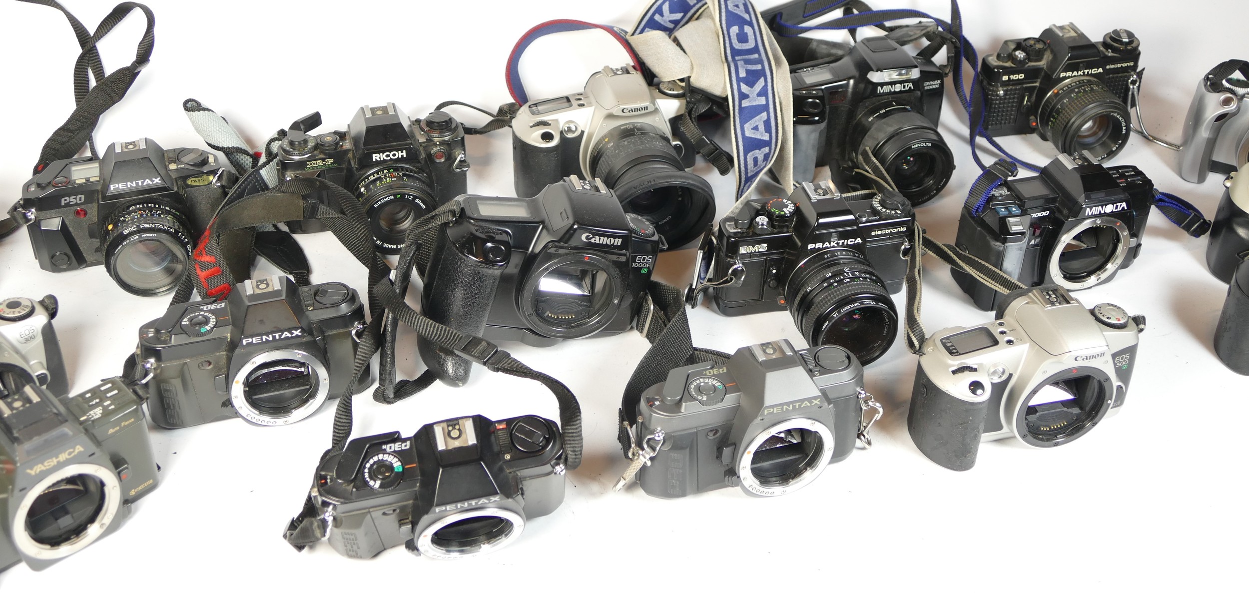 Twenty five SLR vintage film cameras to include a Nikon F80, a Ricoh XR-P, a Canon EOS 300 and a - Image 2 of 2