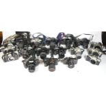 Twenty five SLR vintage film cameras to include a Canon EOS 1000f, a Minolta X-370s, a Pentax MZ-