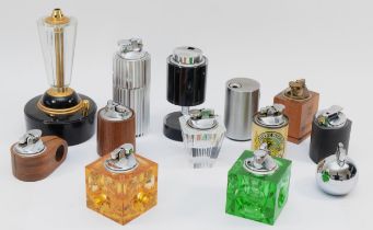 A collection of mid 20th century and later table cigarette lighters, petrol and gas filled.