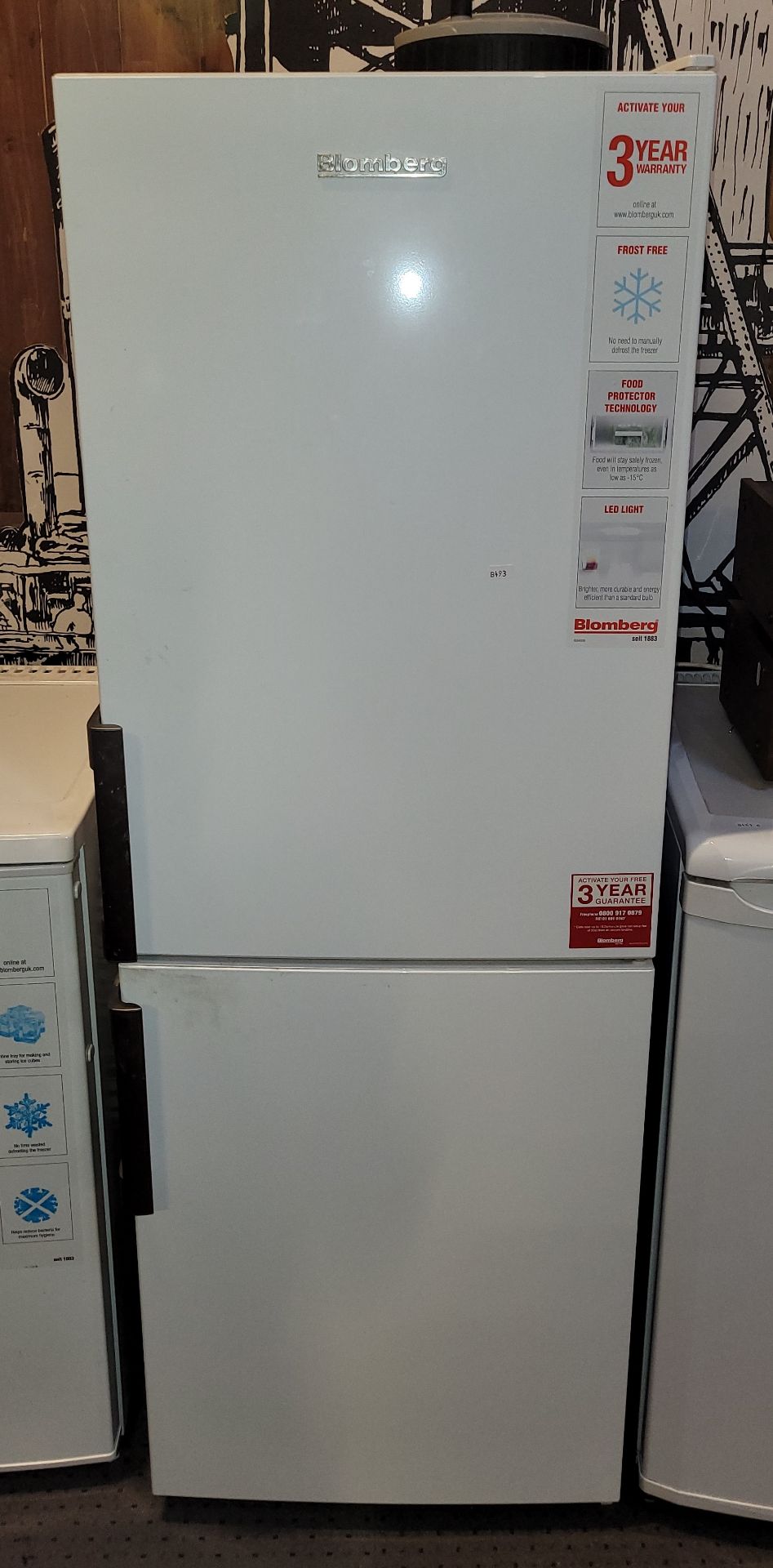 A Bloomberg freestanding fridge/freezer. W54, D54, H152cm.