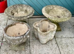 A pair of stoneware garden planters, 53cm diameter, together with two smaller examples. (3)