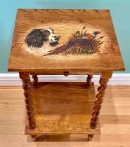 A 20th century oak side table with pokerwork decorated top, signed G. Gundill, having single