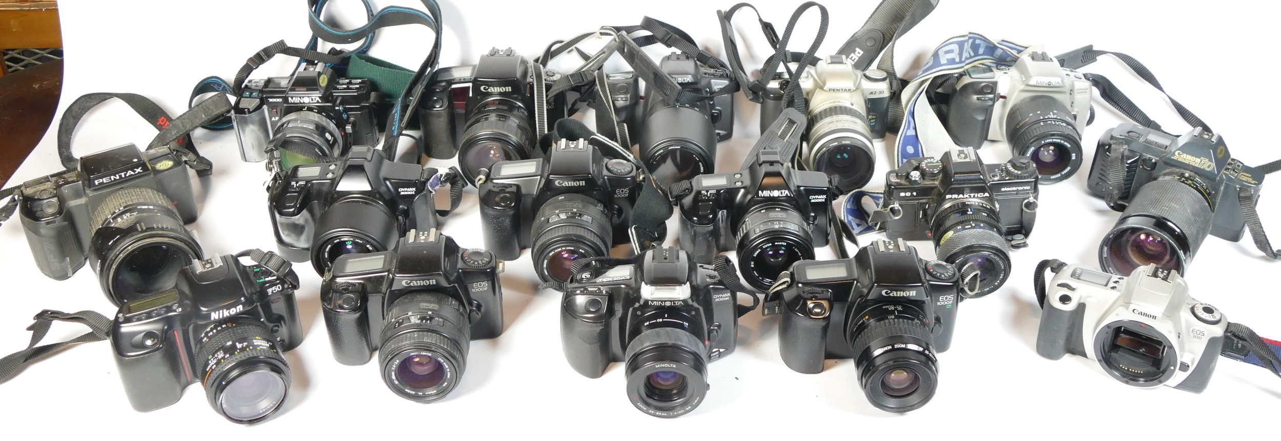 Twenty three SLR vintage film cameras to include a Minolta 500si, a Nikon F50, a Praktica BC1, a
