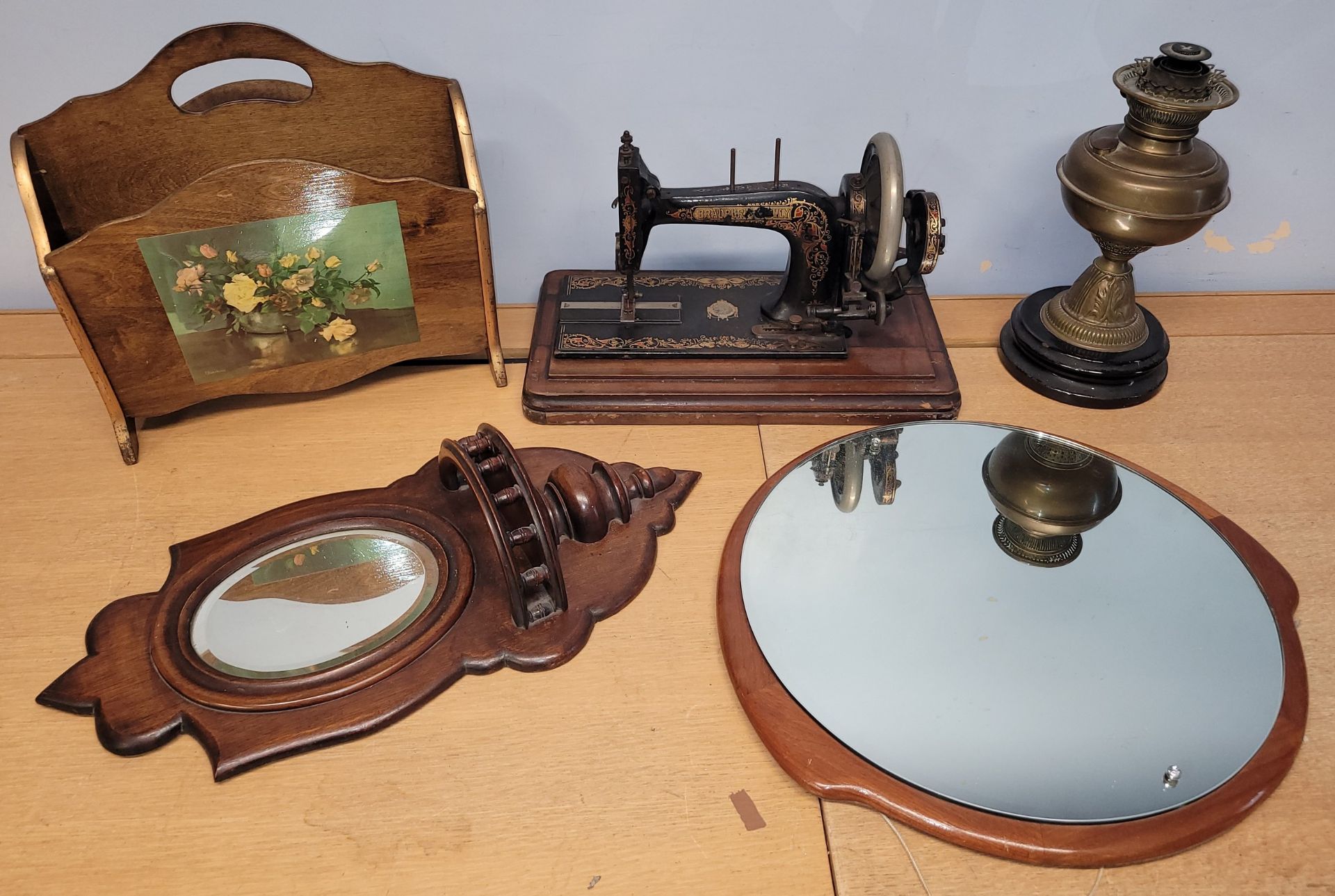 An early 20th century 'Bradbury & Family' cased manual operated sewing machine, together with a