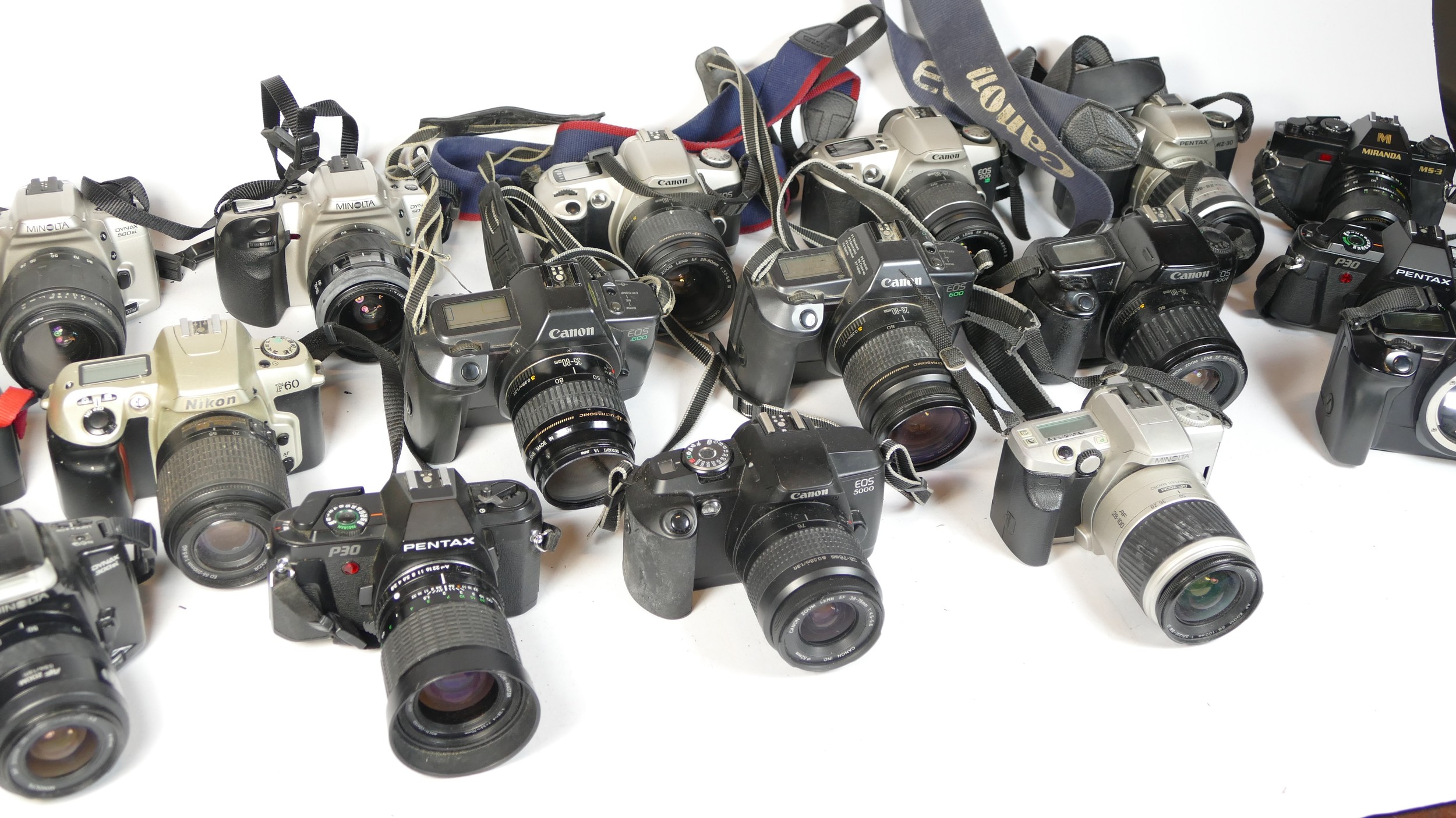 Twenty five SLR vintage film cameras to include a Canon EOS 5000, a Nikon F60, a Cosina C1 and a - Image 2 of 2