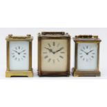 Three mid 20th century carriage clocks, having 8 day movements with floating balance enamelled dials