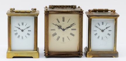 Three mid 20th century carriage clocks, having 8 day movements with floating balance enamelled dials