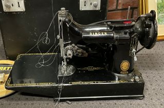 A mid 20th century electric Singer sewing machine, cased, model number 221K