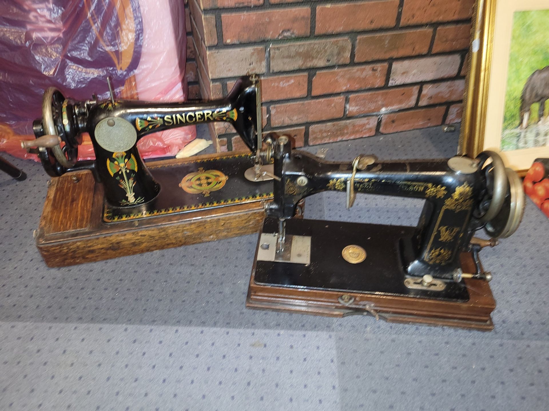 An early 20th century cased Whelen & Wilson manual sewing machine, together with a cased Singer