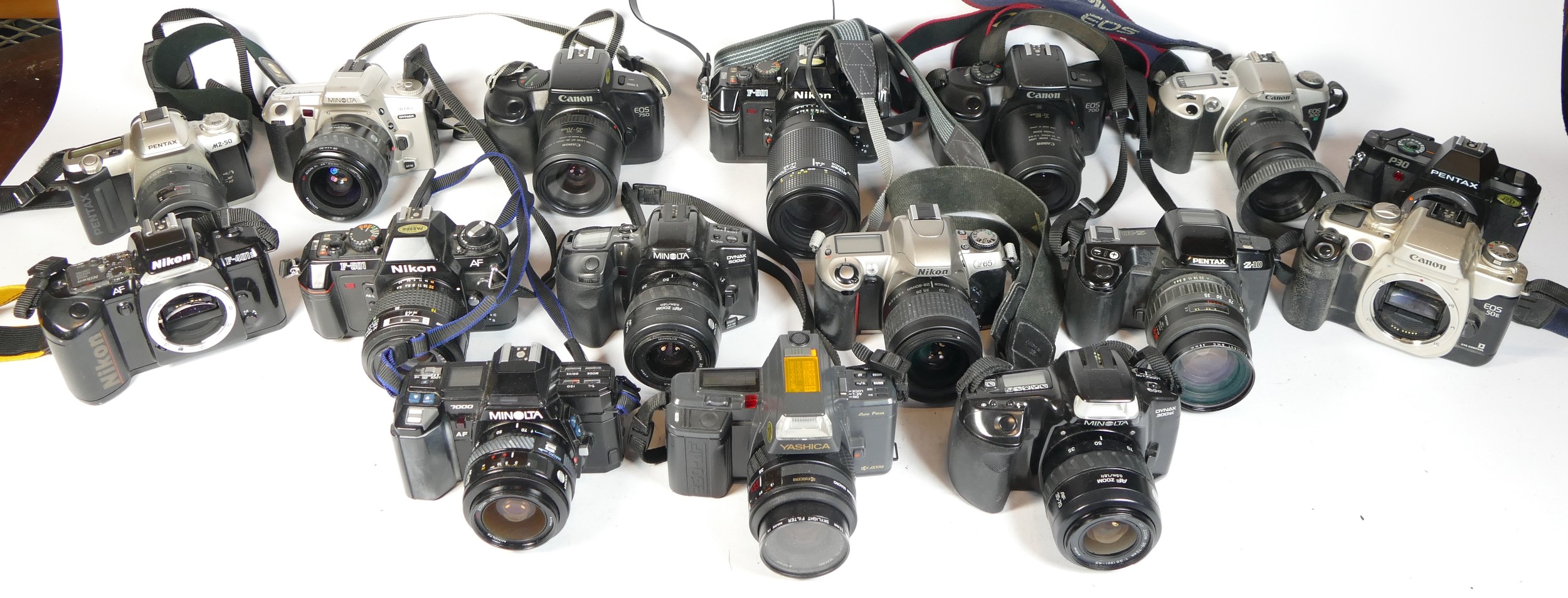 Twenty SLR vintage film cameras to include a Nikon F-501, a Pentax Z-10, a Canon EOS 50E and a