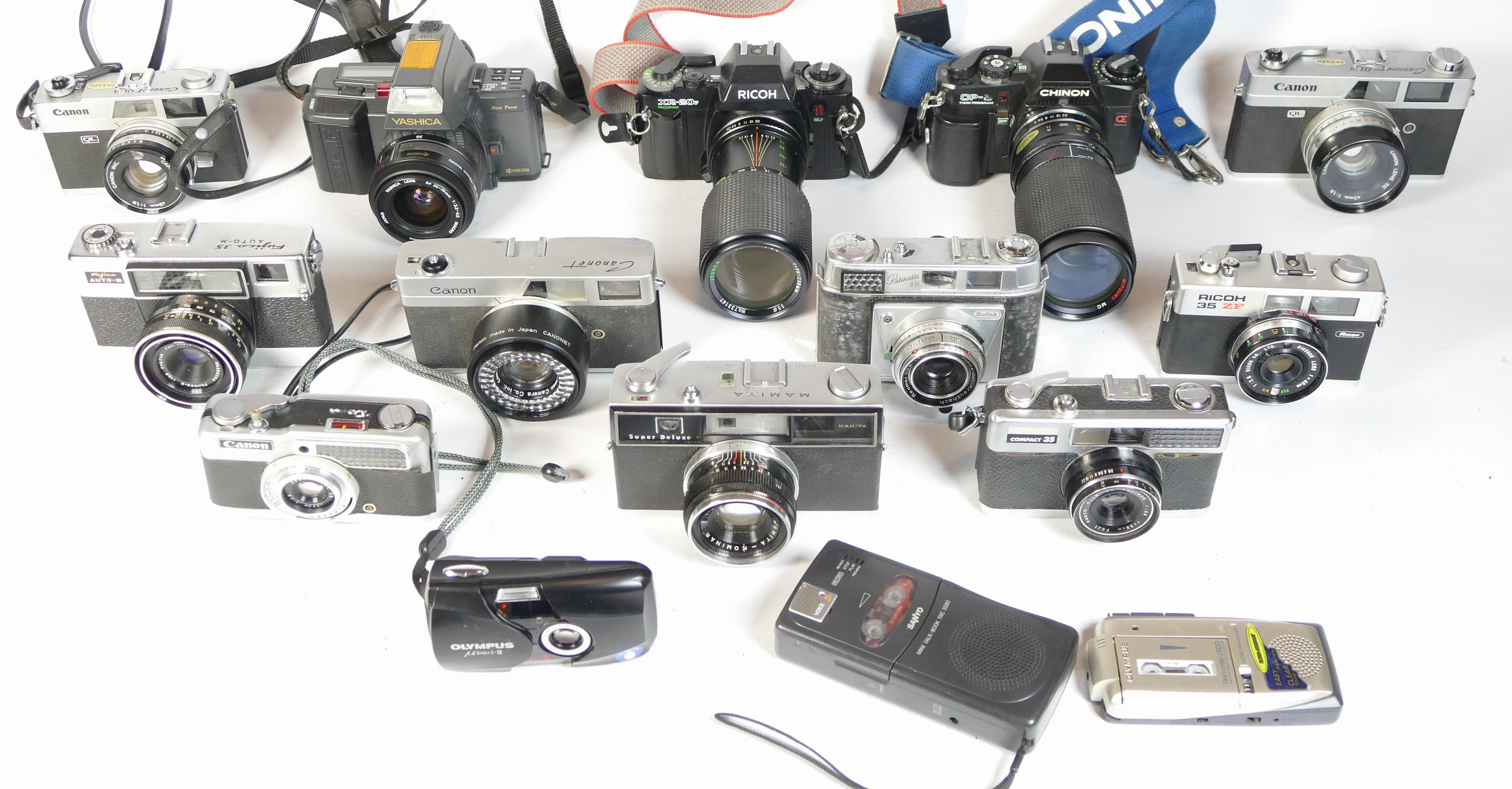 Eleven SLR vintage film cameras to include a Fujica 35, a Mamiya, a Ricoh XR-20 and a Chinon CP5.