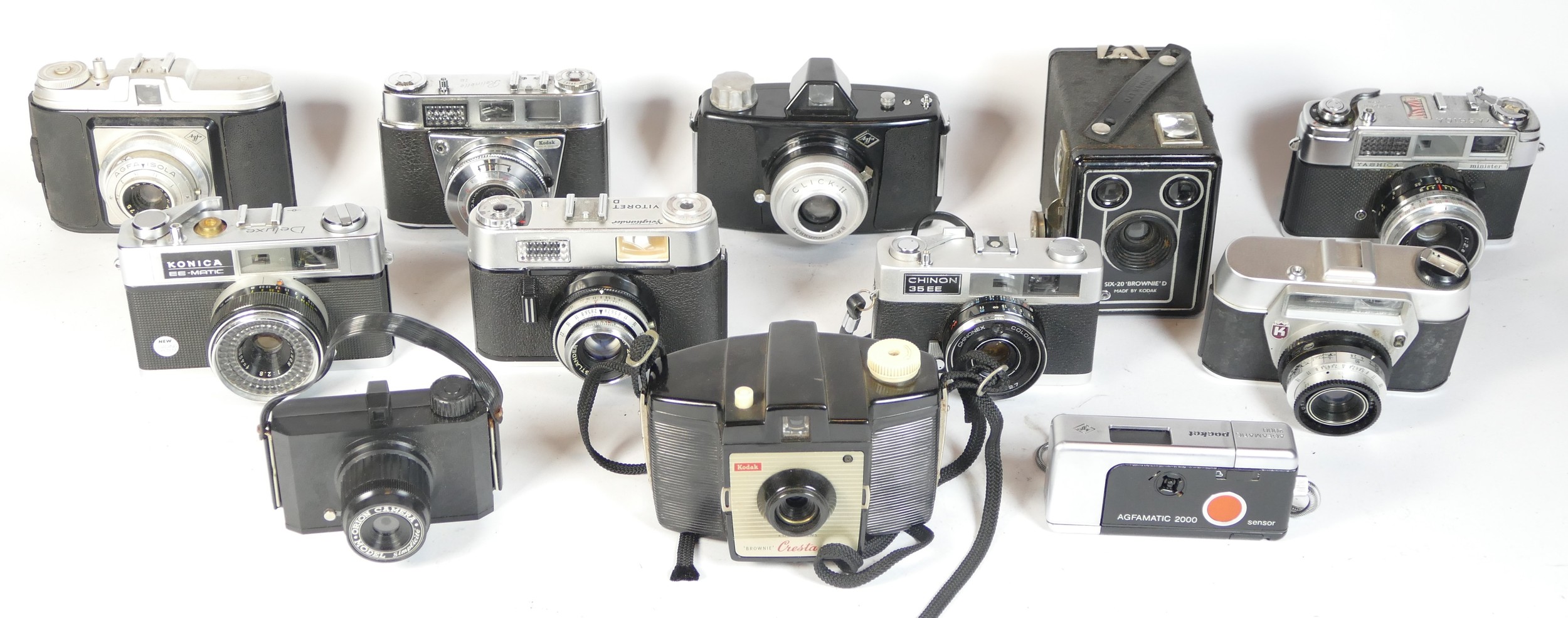 Twelve mixed cameras to include a Kodak SIX-20 "Brownie", a Konica EE Matic, a Kodak Retinette and a