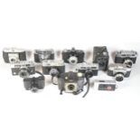 Twelve mixed cameras to include a Kodak SIX-20 "Brownie", a Konica EE Matic, a Kodak Retinette and a