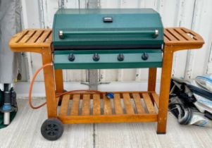 An Outback gas fired trolley BBQ.