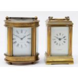 Two English miniature brass case carriage clocks, having 8 day movements, 9cm tall. (2)