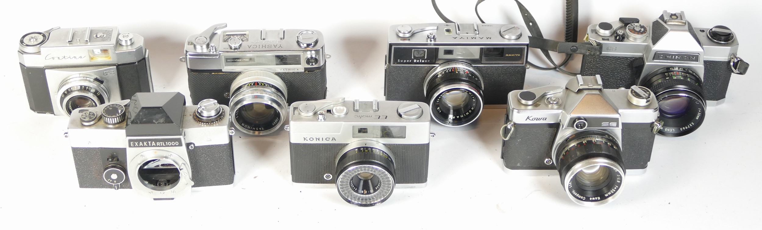 Seven SLR vintage film cameras to include a Mamiya Super Deluxe, a Yashica Minister 700, a Chinon CS