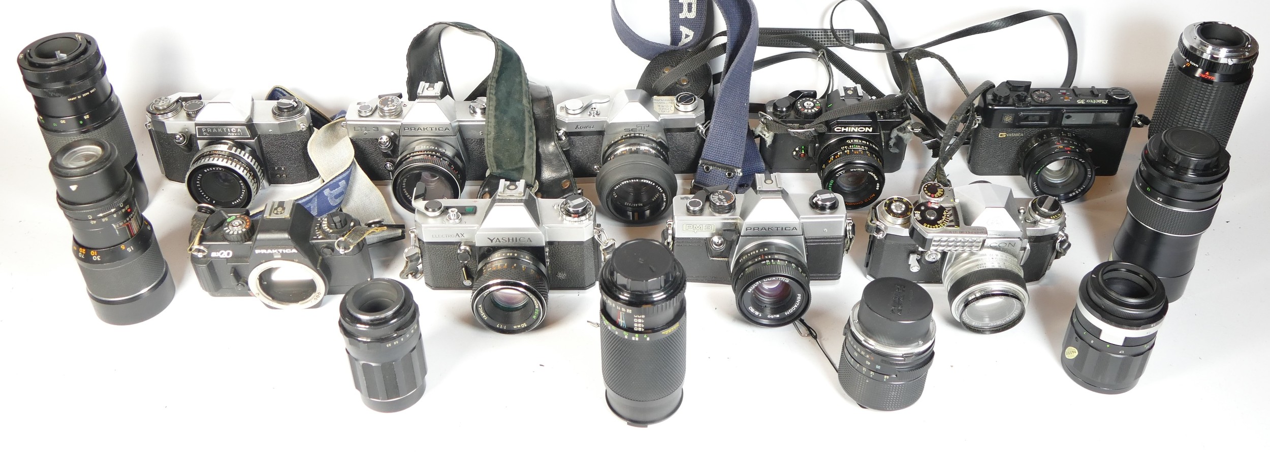 Nine SLR vintage film cameras to include a Yashica AX, a Praktica PM3, a Praktica LTL3 and a