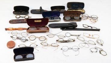 A collection of early 20th century and later spectacles, cased and loose.