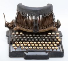 A Royal Bar-lock typewriter circa early 20th century, having a qwerty keyboard, embossed fret