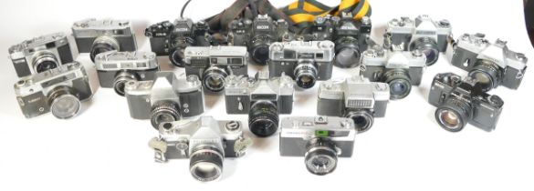 Twenty SLR vintage film cameras to include a Praktica IV, a Mamiya DSX1000, a Petri 7sII and a Ricoh