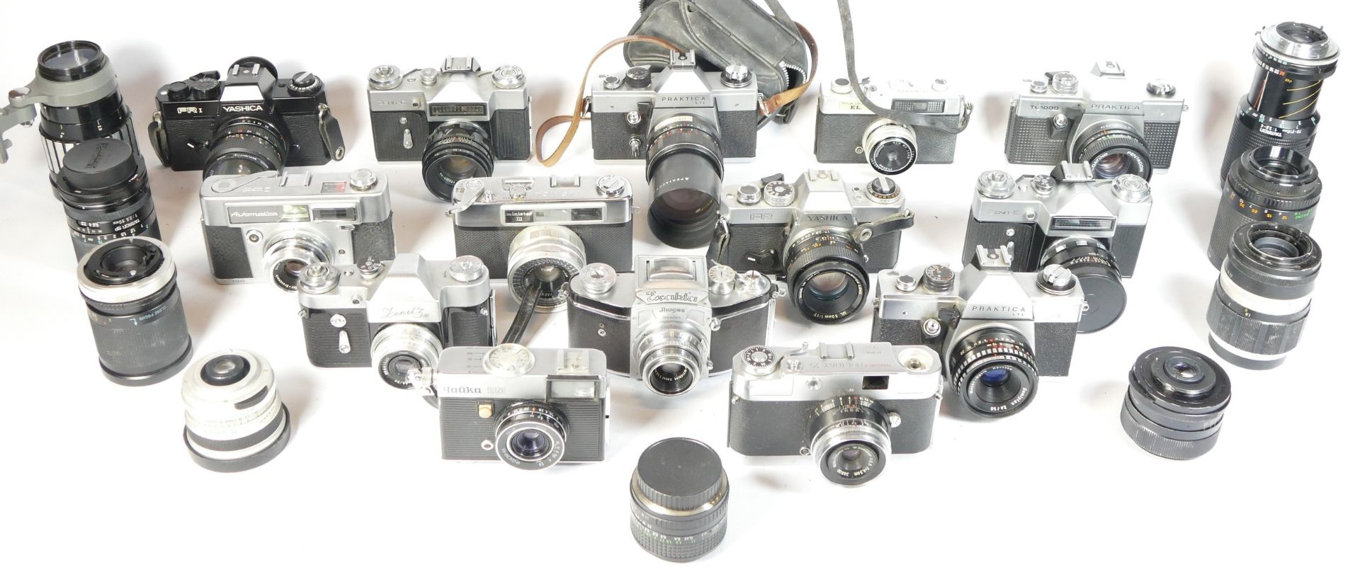 Fourteen SLR vintage film cameras to include a Yashica FR, a Hanimex Holiday 35, a Yashica FR1,