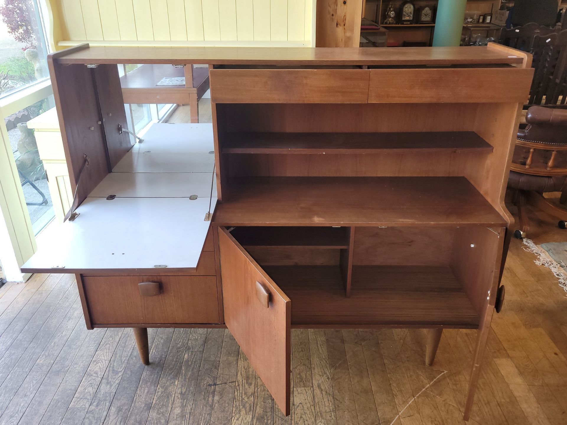 Stonehill Furniture: A mid 20th century teak sideboard/drinks cabinet. W152, H121, D45cm. - Image 3 of 4