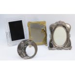 An Art Nouveau style brass dressing table mirror, 23x17cm, together with a circular plated picture