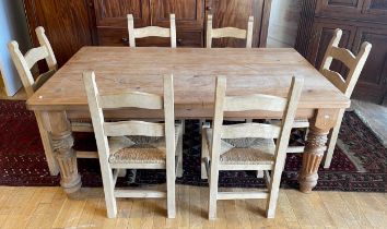 A country pine dining suite, comprising rectangular plank top table, having single frieze drawers to