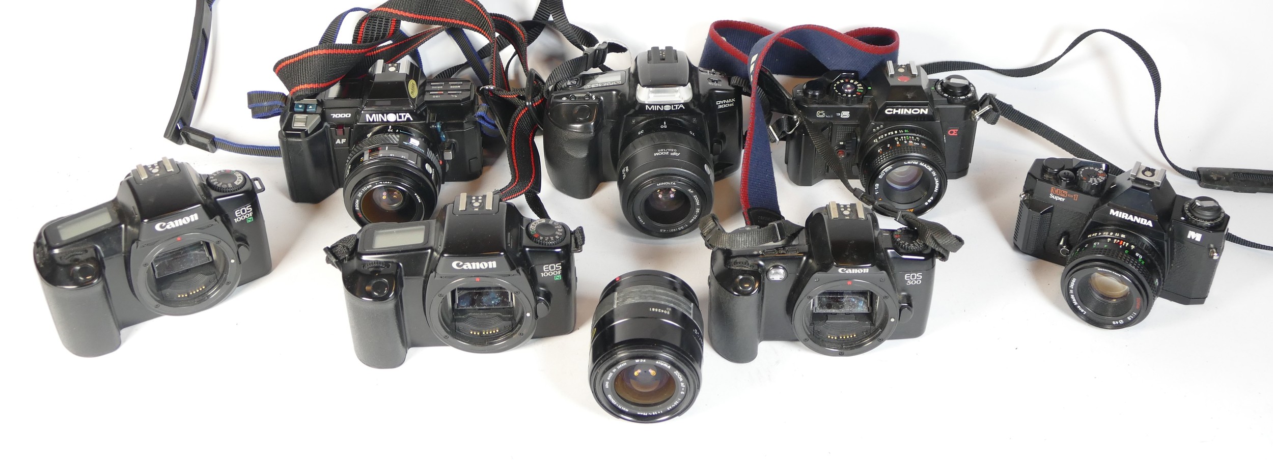 Seven SLR vintage film cameras to include a Minolta 300si, a Miranda MS-1, a Canon EOS 1000f and a