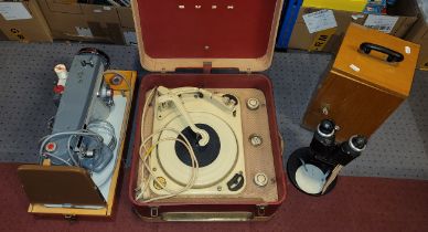 A 1950s Garrard portable record player, together with a 1970s Jones sewing machine and a 20th