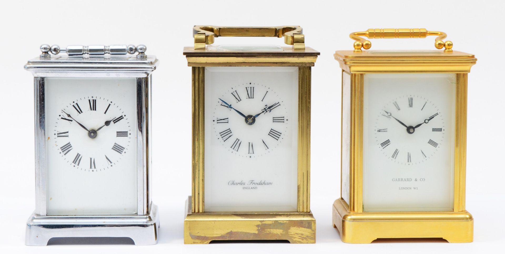 Two 20th century brass 8 day carriage clocks, enamelled dials with Roman numerals, together with a