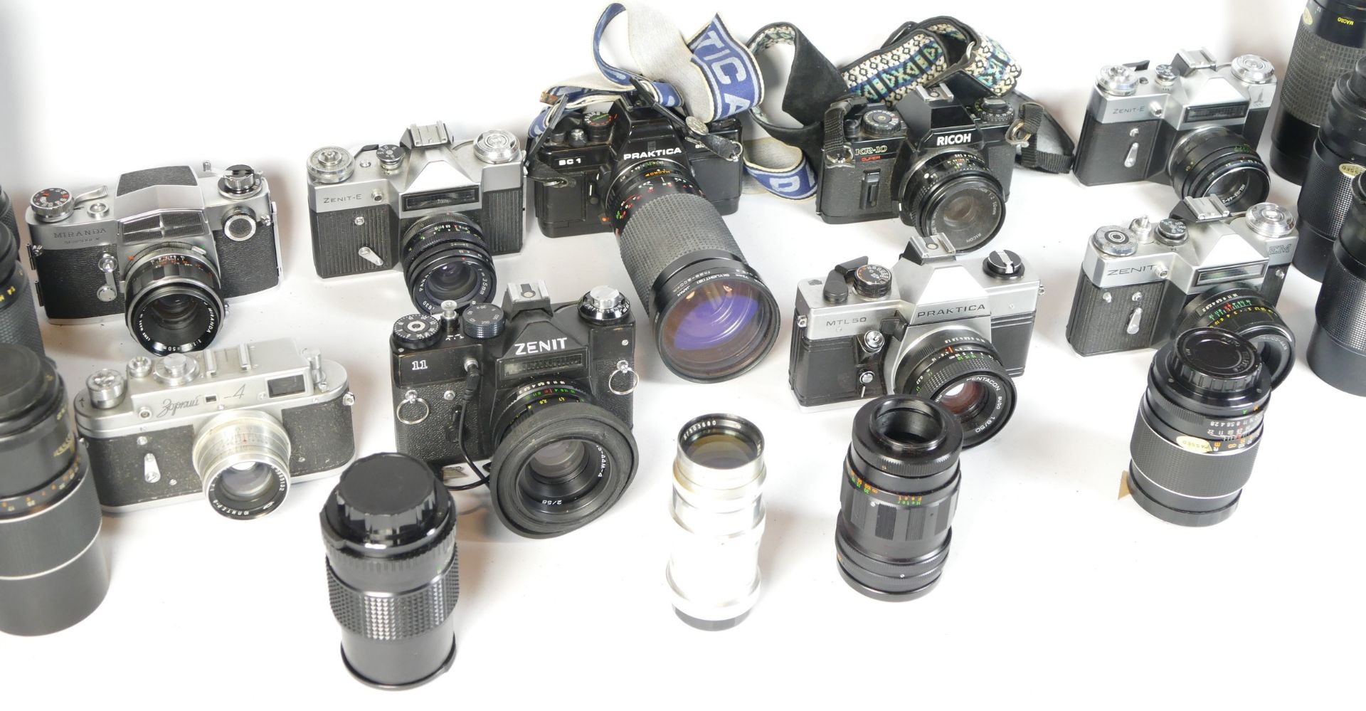 Eight SLR vintage film cameras to include a Zenit E, a Praktica BC1, a Ricoh KR10 and a Zenit II. - Image 2 of 4