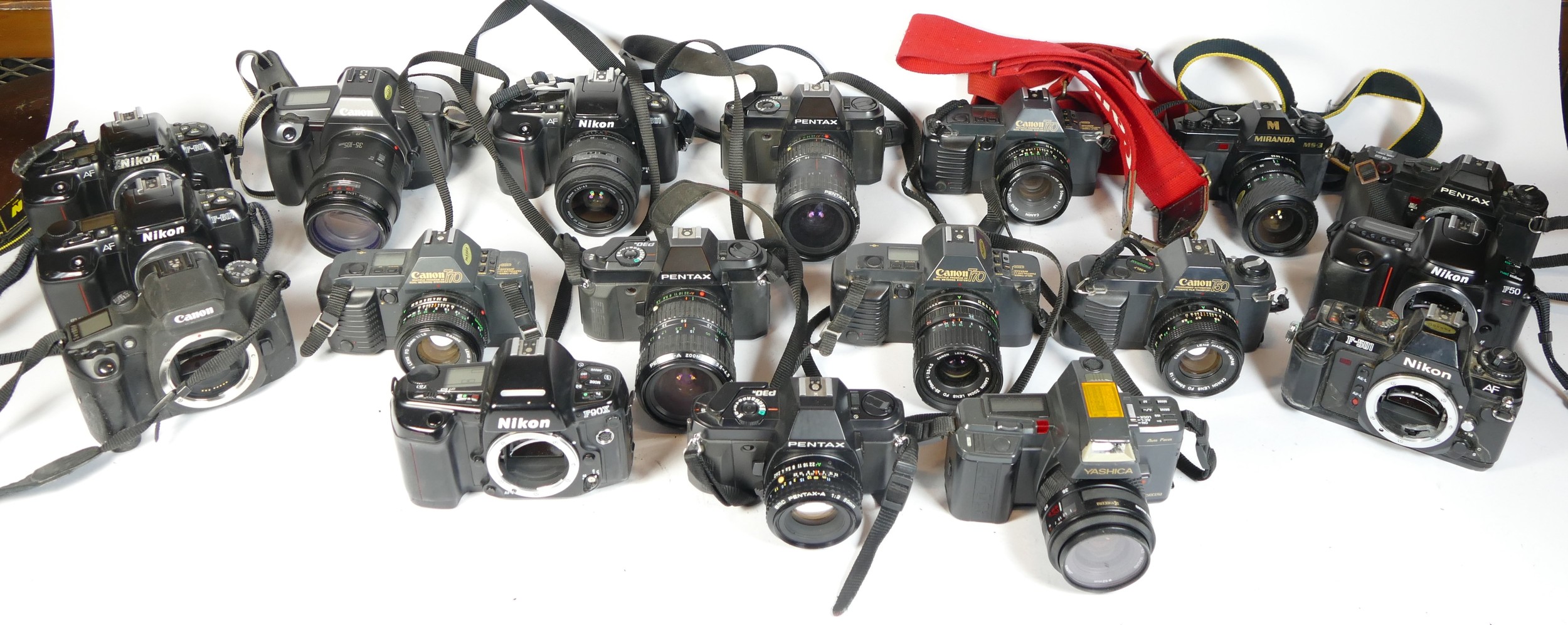 Twenty seven SLR vintage film cameras to include a Pentax P30, a Nikon F301, a Canon T70 and a Nikon