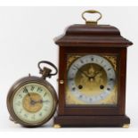 An early 20th century brass case ezel mantel clock in the form of an oversized pocket watch, the