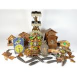 A collection of mid 20th century cuckoo clocks, having mechanical movements, for spares or repair.