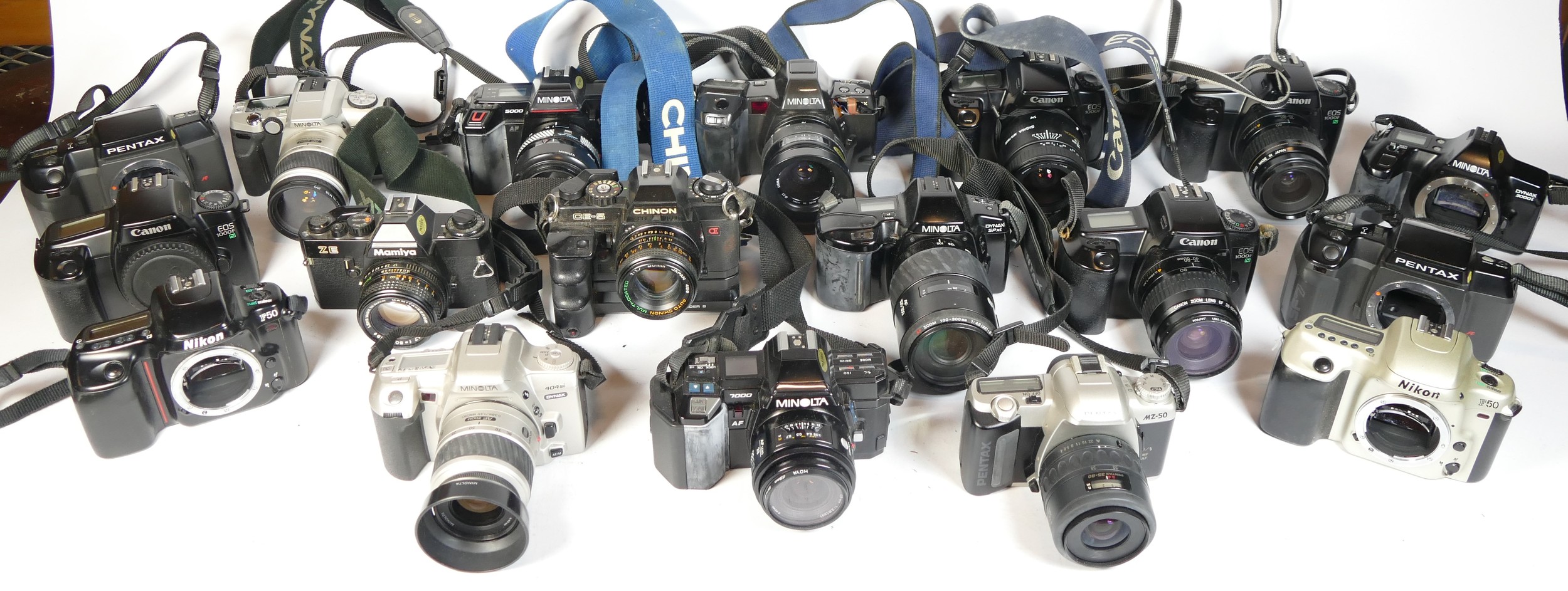 Twenty three SLR vintage film cameras to include a Canon EOS 500, a Nikon F50, a Minolta 5000 and