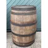 A large bound coopered oak barrel. H87, D55cm.