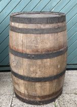 A large bound coopered oak barrel. H87, D55cm.