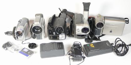 Five video camcorders comprising of a Canon UC8000E, a JVC GR-AX627E, a JVC GR-D21EK, a Canon DM-