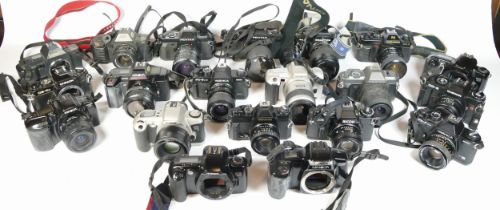 Twenty five SLR vintage film cameras to include a Canon EOS 500N, a Pentax P30N, a Praktica BC1