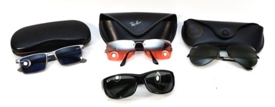 Four pairs of Ray Ban sunglasses.