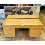 A mid 20th century Stag teak dressing table, model S.322, mirror back over central drawer flanked by