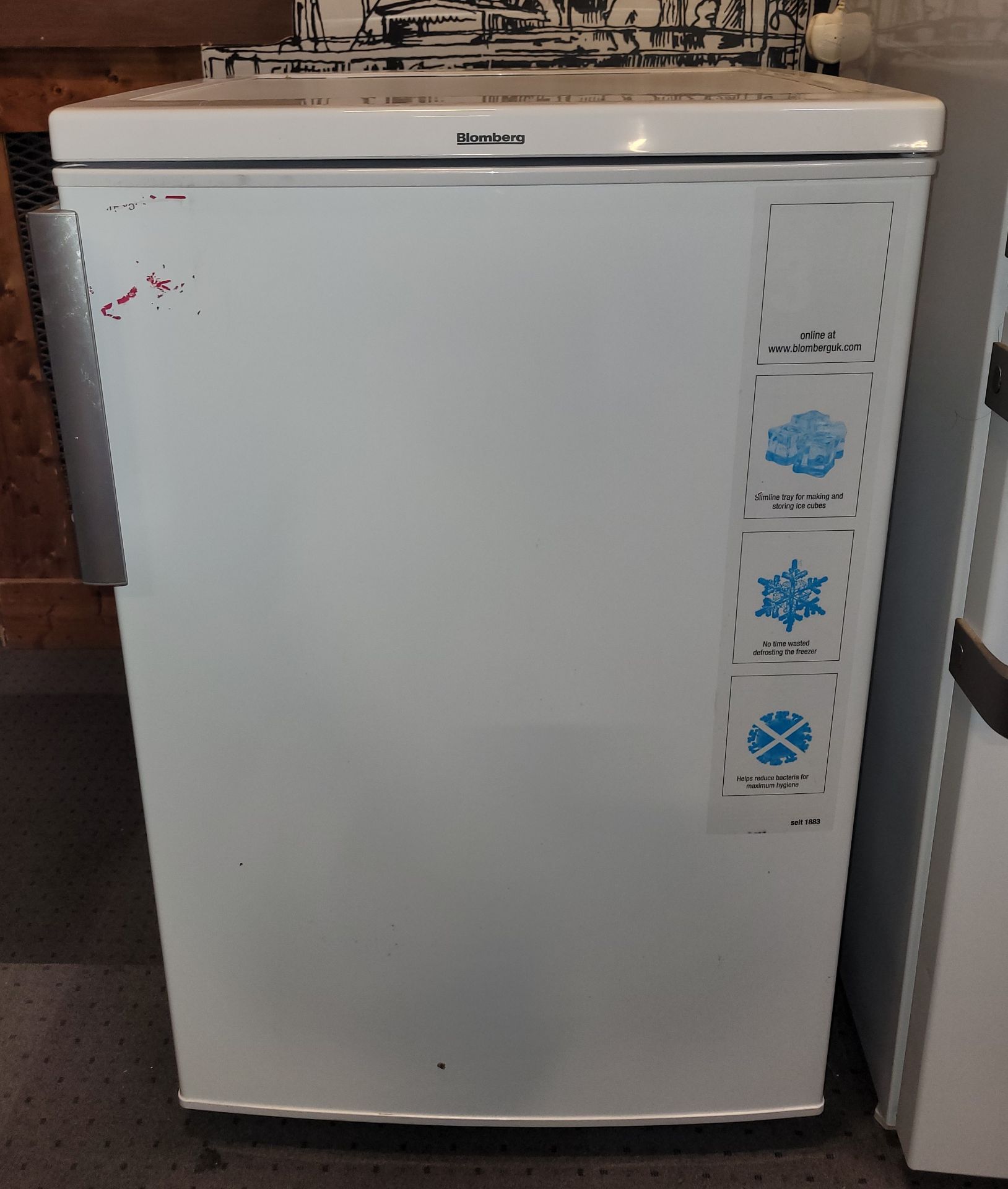 A Bloomberg undercounter freezer. W54, D60, H84cm.