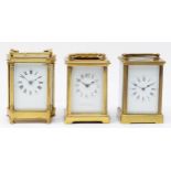 Three French 20th century brass carriage clocks, having enamelled dials with Roman numerals