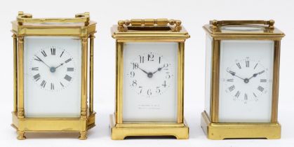 Three French 20th century brass carriage clocks, having enamelled dials with Roman numerals