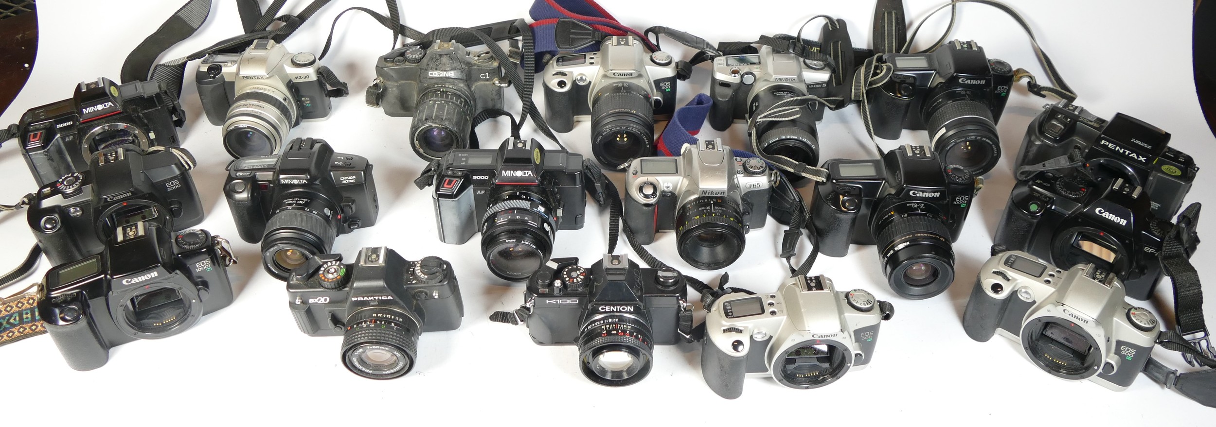 Twenty five SLR vintage film cameras to include a Cosina C1, a Canon EOS 1000f, a Centon K100 and