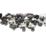 Twenty two SLR vintage film cameras to include a canon EOS 1000, a Canon EOS 500, a Nikon F50 and