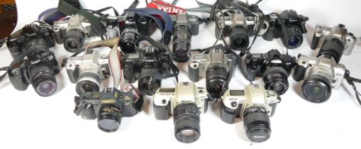 Twenty two SLR vintage film cameras to include a canon EOS 1000, a Canon EOS 500, a Nikon F50 and